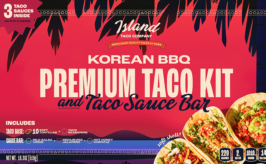 Front packaging of the Island Taco Company Korean BBQ Premium Taco Kit and Taco Sauce Bar, featuring a red and black tropical design with taco illustrations and text detailing the included taco base and sauce bar.